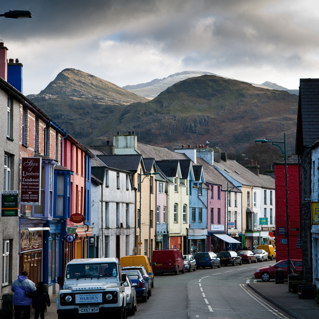 Llanberis high street & painted buildings with Snowdon behind