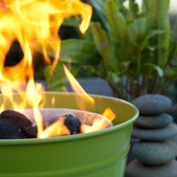 Preparing coals for alfresco summer dining