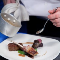 Food being plated for service