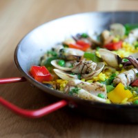 Seafood paella in red skillet